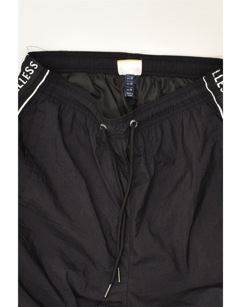 ELLESSE Mens Tracksuit Trousers Joggers  Medium  Black Polyamide | Vintage Ellesse | Thrift | Second-Hand Ellesse | Used Clothing | Messina Hembry 