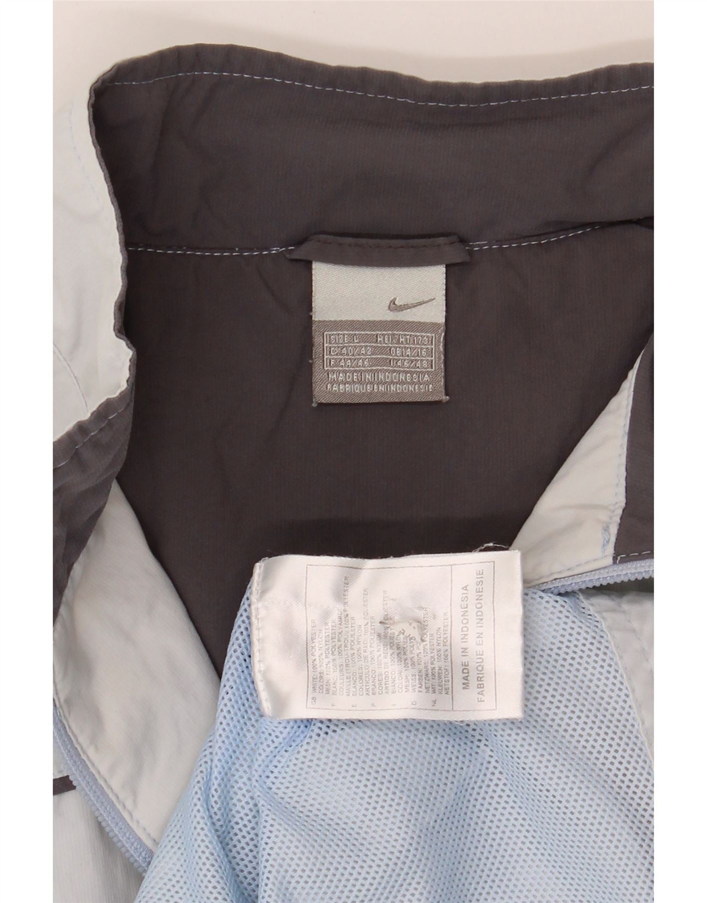 NIKE Womens Tracksuit Top Jacket UK 14/16 Large Blue Polyester Vintage Nike and Second-Hand Nike from Messina Hembry