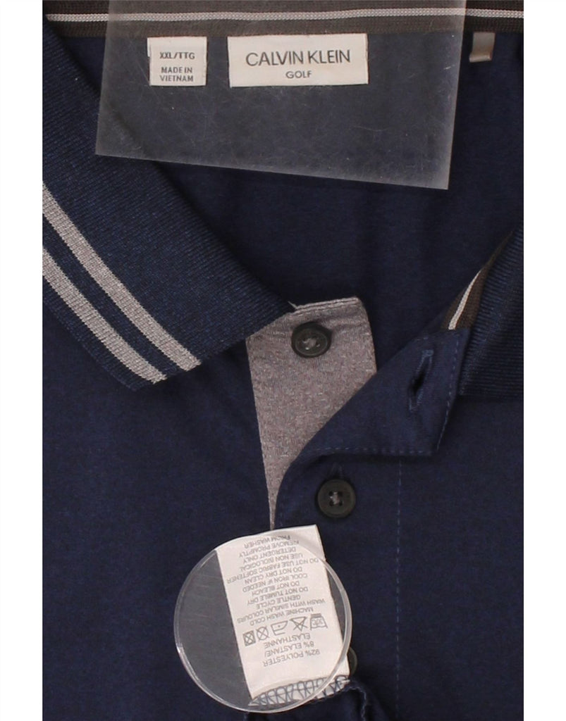 CALVIN KLEIN Mens Golf Polo Shirt 2XL Navy Blue Polyester Vintage Calvin Klein and Second-Hand Calvin Klein from Messina Hembry 