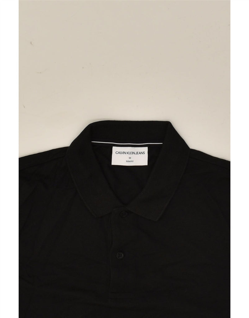 CALVIN KLEIN JEANS Mens Slim Fit Graphic Polo Shirt Medium Black Cotton | Vintage Calvin Klein Jeans | Thrift | Second-Hand Calvin Klein Jeans | Used Clothing | Messina Hembry 