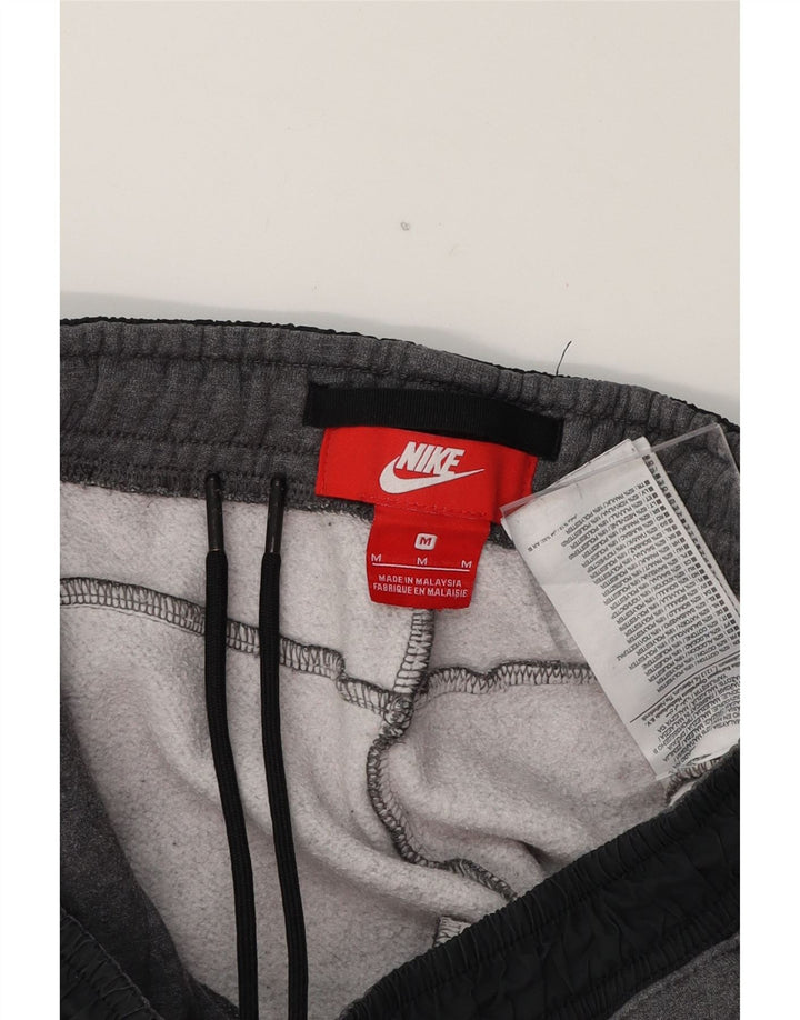 NIKE Mens Tracksuit Trousers Joggers Medium  Grey Cotton Vintage Nike and Second-Hand Nike from Messina Hembry 