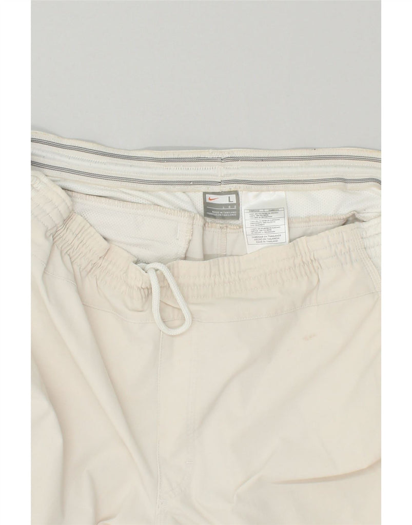 NIKE Mens Capri Tracksuit Trousers Large Beige Colourblock Polyester | Vintage Nike | Thrift | Second-Hand Nike | Used Clothing | Messina Hembry 