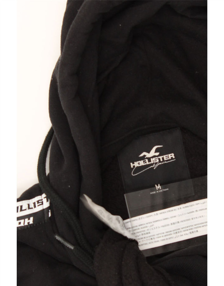 HOLLISTER Mens Graphic Hoodie Jumper Medium Black Cotton Vintage Hollister and Second-Hand Hollister from Messina Hembry 