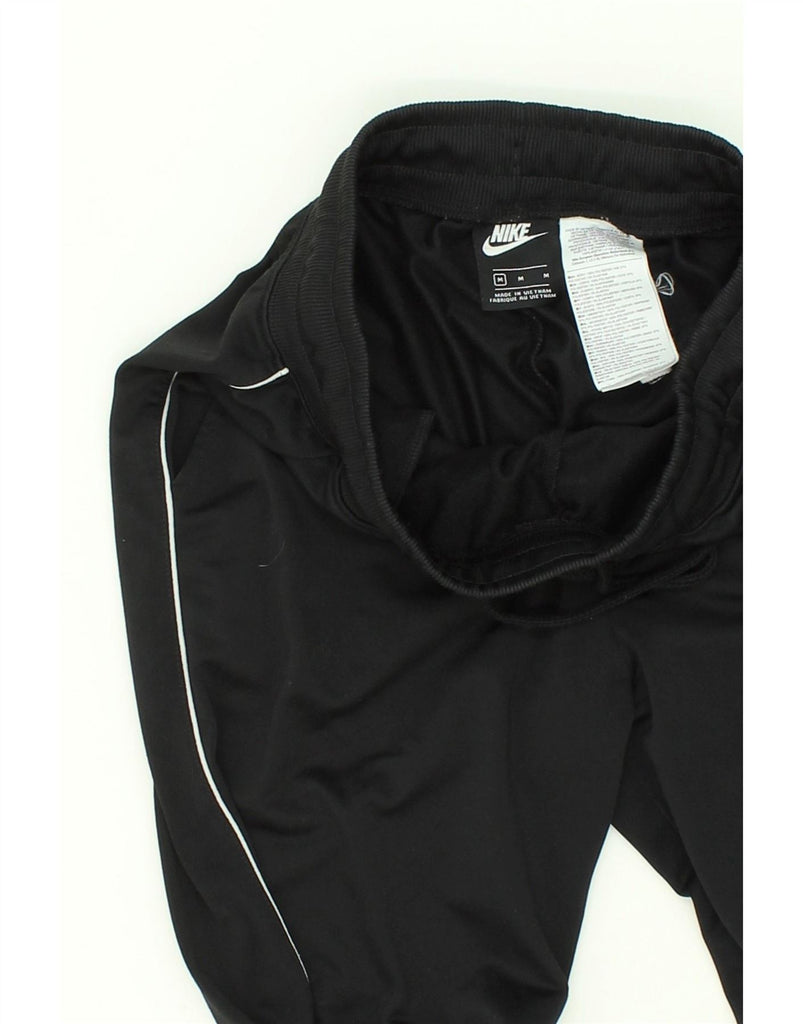 NIKE Mens Tracksuit Trousers Joggers Medium Black Polyester Vintage Nike and Second-Hand Nike from Messina Hembry 