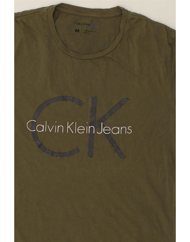 CALVIN KLEIN JEANS Mens Graphic T-Shirt Top Medium Green Cotton Vintage Calvin Klein Jeans and Second-Hand Calvin Klein Jeans from Messina Hembry 