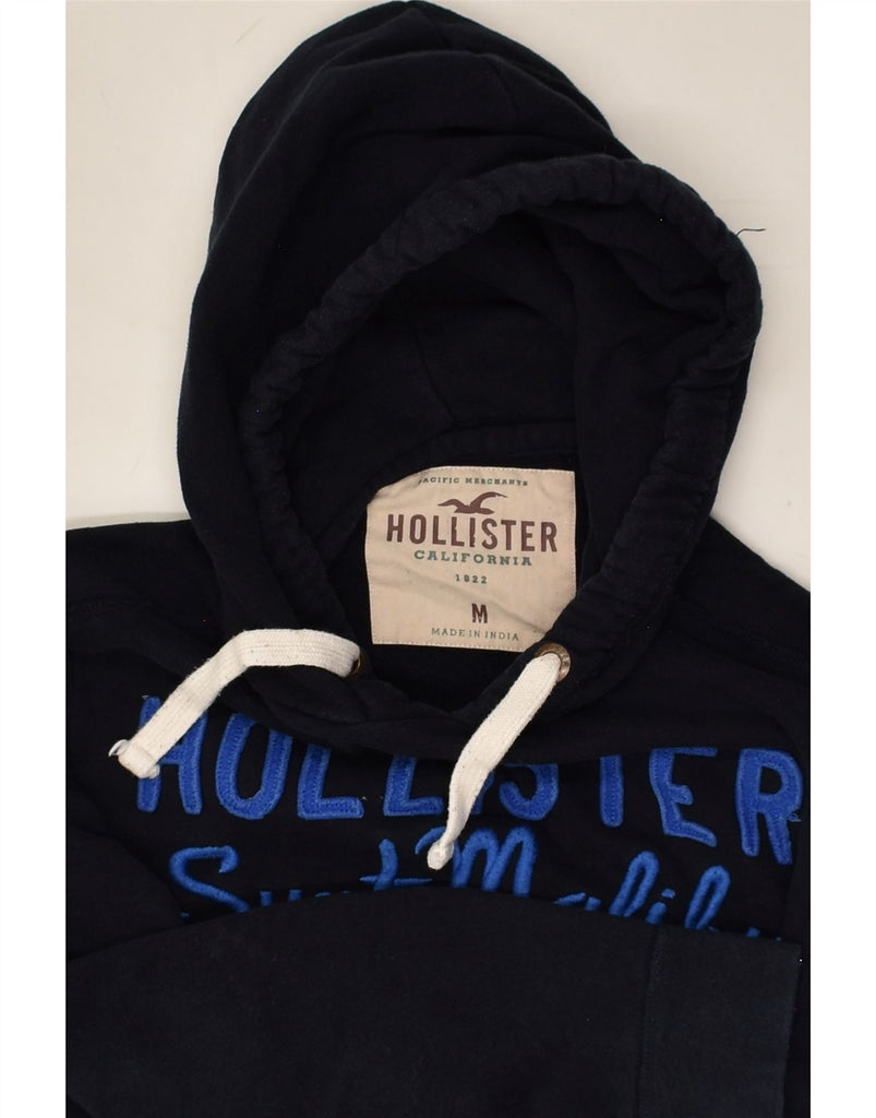 HOLLISTER Womens Graphic Hoodie Jumper UK 14 Medium Navy Blue Cotton | Vintage Hollister | Thrift | Second-Hand Hollister | Used Clothing | Messina Hembry 