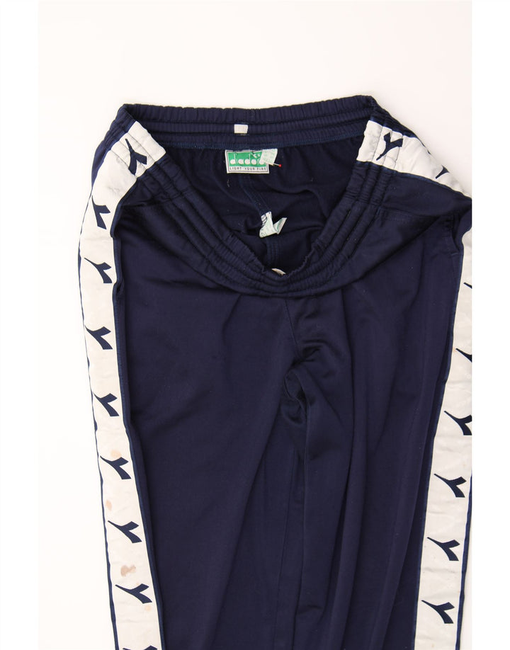 DIADORA Mens Graphic Tracksuit Trousers Medium  Navy Blue Colourblock Vintage Diadora and Second-Hand Diadora from Messina Hembry 