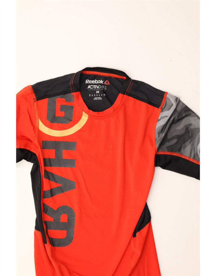 REEBOK Boys Graphic T-Shirt Top 13-14 Years Medium Orange Colourblock Vintage Reebok and Second-Hand Reebok from Messina Hembry 