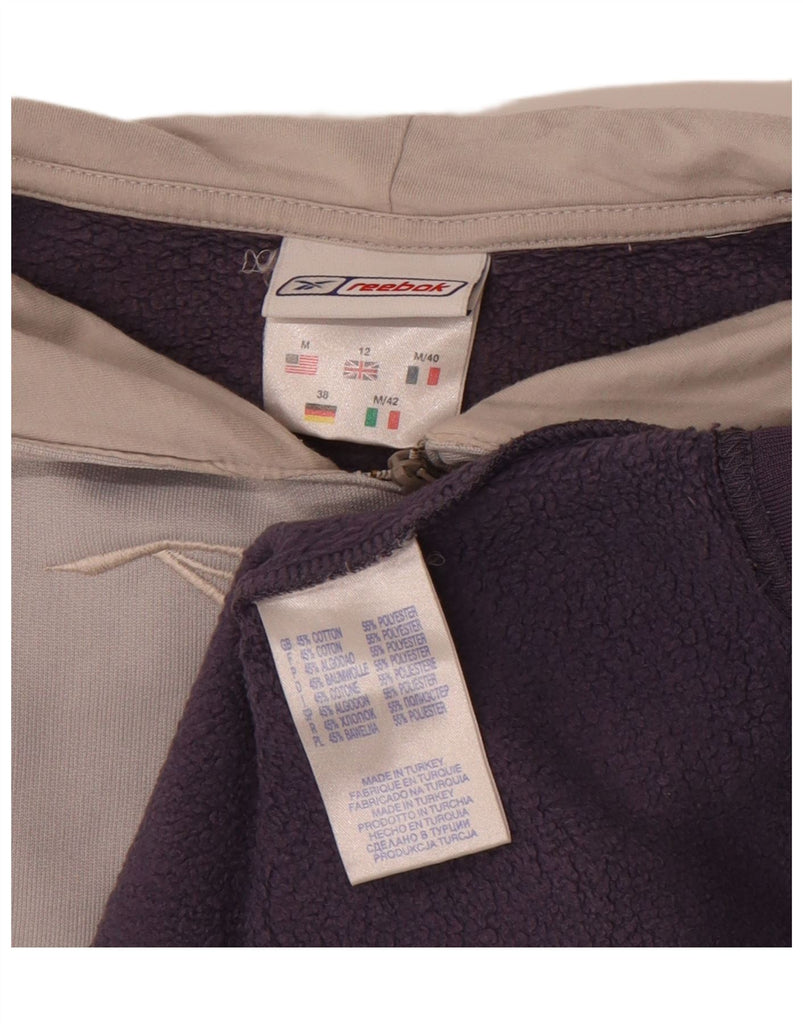 REEBOK Womens Graphic Hoodie Jumper UK 12 Medium Purple Colourblock Cotton Vintage Reebok and Second-Hand Reebok from Messina Hembry 