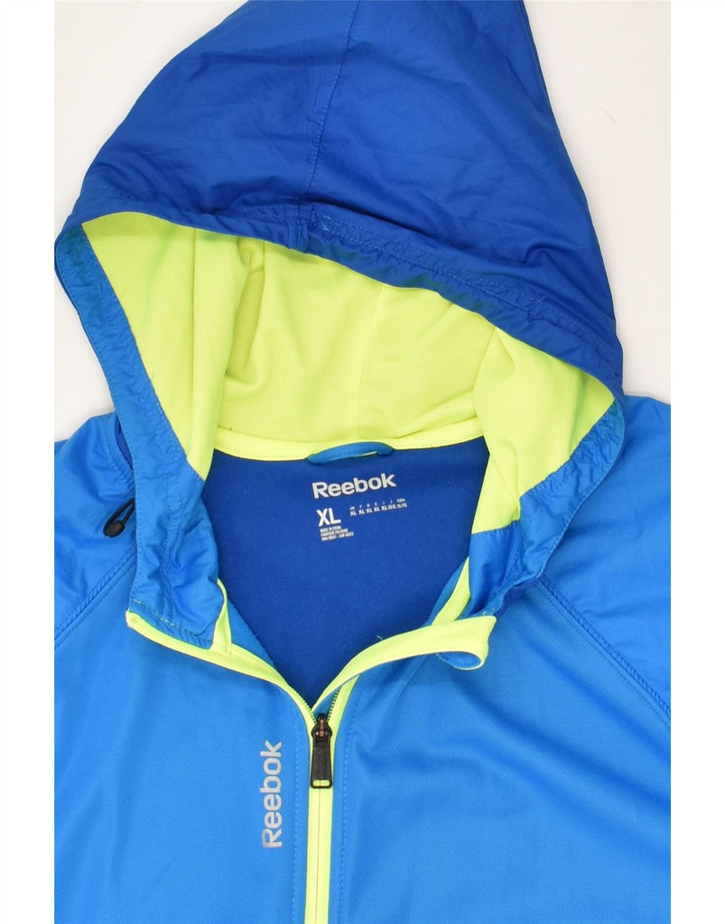 REEBOK Mens Hooded Tracksuit Top Jacket XL Blue Colourblock Polyester Vintage Reebok and Second-Hand Reebok from Messina Hembry 