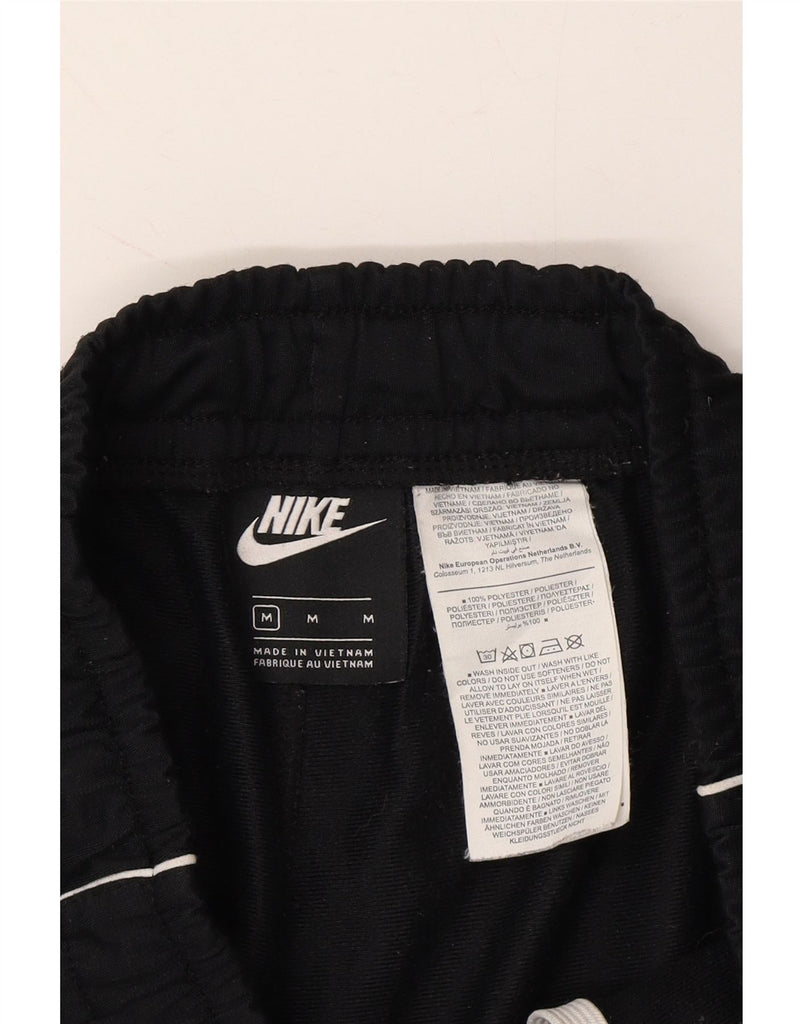 NIKE Mens Tracksuit Trousers Joggers Medium  Black Polyester Vintage Nike and Second-Hand Nike from Messina Hembry 