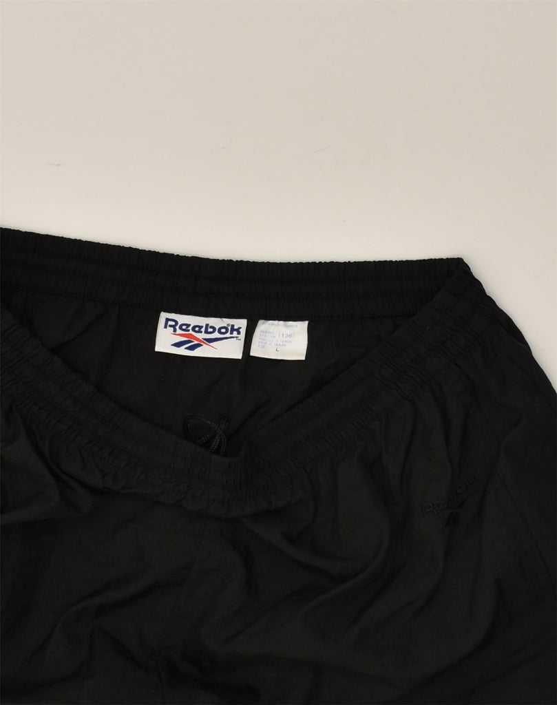 REEBOK Mens Tracksuit Trousers Joggers Large Black Polyamide | Vintage Reebok | Thrift | Second-Hand Reebok | Used Clothing | Messina Hembry 