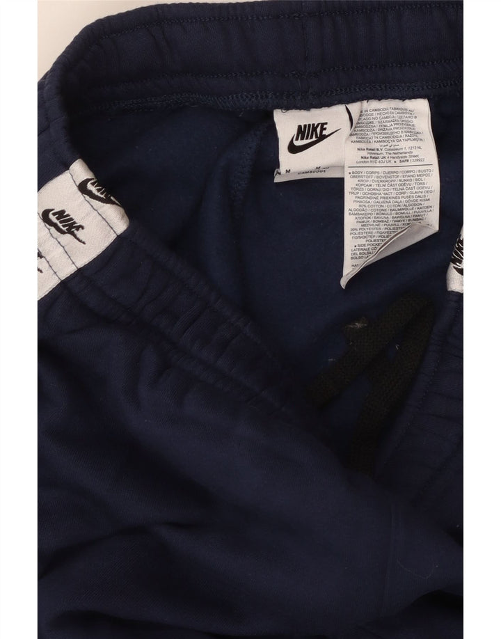 NIKE Mens Graphic Tracksuit Trousers Joggers Medium  Navy Blue Colourblock