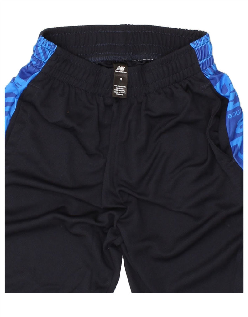 NEW BALANCE Boys Graphic Sport Shorts 11-12 Years Navy Blue Colourblock Vintage New Balance and Second-Hand New Balance from Messina Hembry 