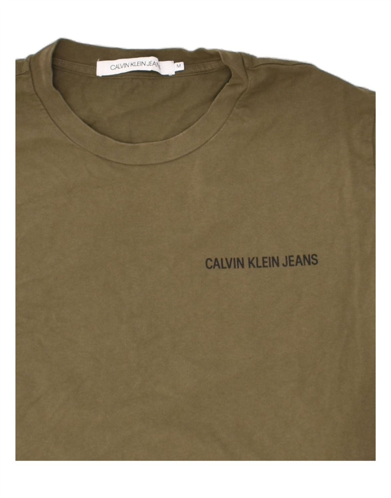 CALVIN KLEIN JEANS Mens Graphic Top Long Sleeve Medium Khaki Cotton Vintage Calvin Klein Jeans and Second-Hand Calvin Klein Jeans from Messina Hembry 