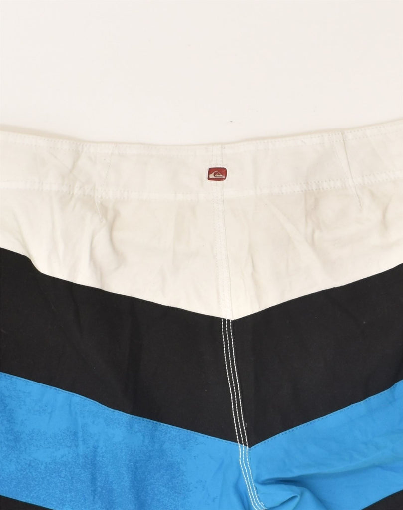 QUIKSILVER Mens Swimming Shorts Large Blue Colourblock Polyamide | Vintage Quiksilver | Thrift | Second-Hand Quiksilver | Used Clothing | Messina Hembry 