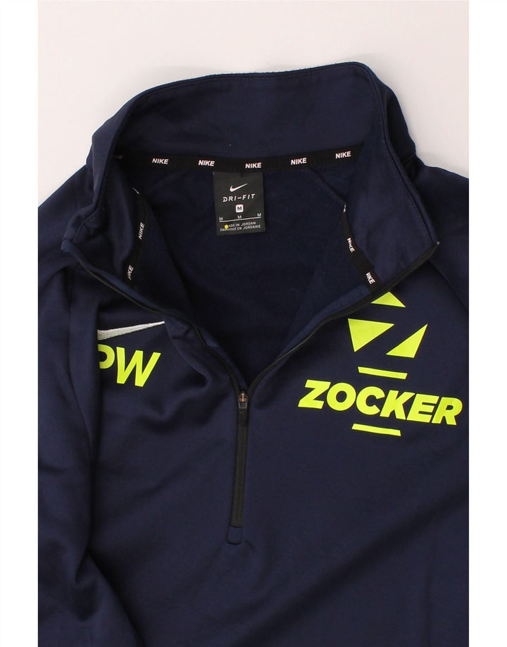 NIKE Mens Dri Fit Graphic Zip Neck Pullover Tracksuit Top Medium Navy Blue Vintage Nike and Second-Hand Nike from Messina Hembry 