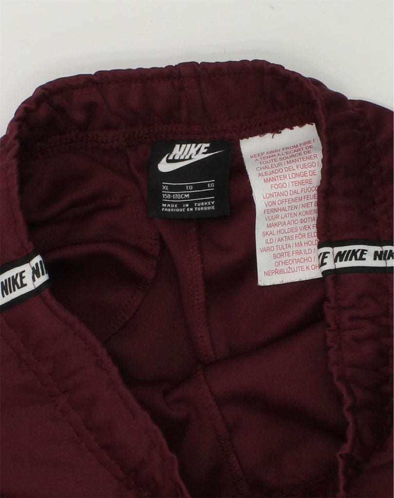 NIKE Girls Tracksuit Trousers Joggers 15-16 Years XL  Burgundy Polyester | Vintage Nike | Thrift | Second-Hand Nike | Used Clothing | Messina Hembry 