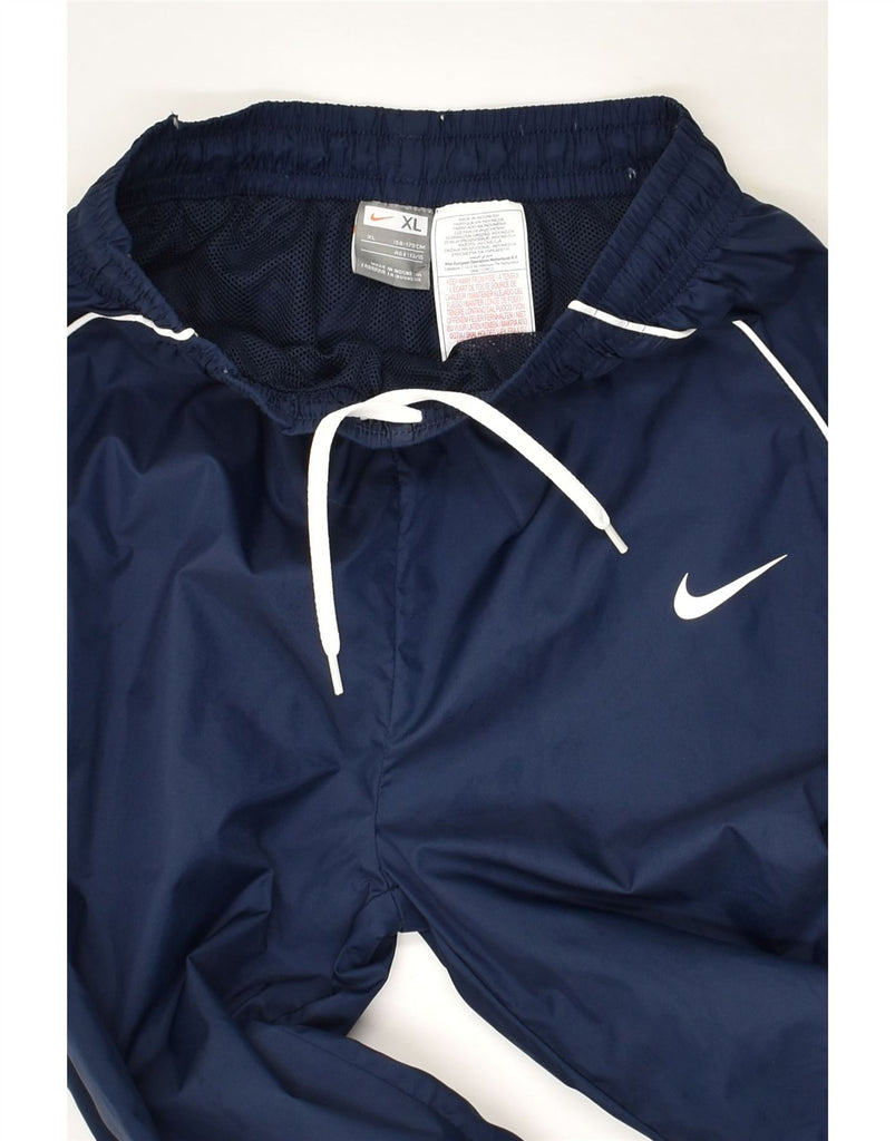 NIKE Boys Tracksuit Trousers 13-14 Years XL Navy Blue Polyester | Vintage Nike | Thrift | Second-Hand Nike | Used Clothing | Messina Hembry 