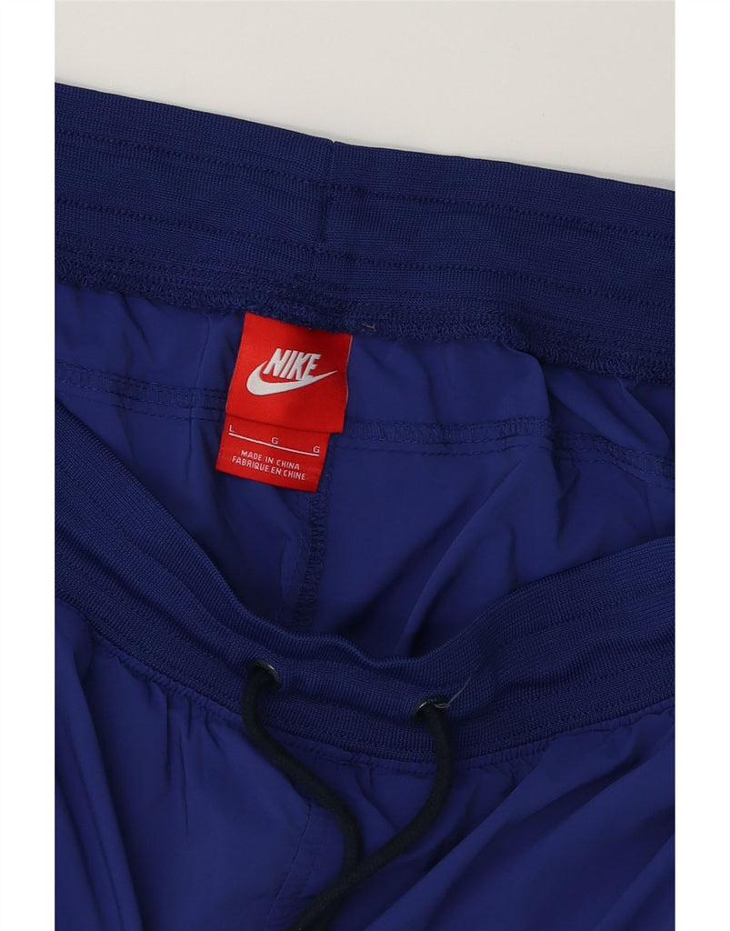 NIKE Mens Tracksuit Trousers Joggers Large Blue Polyester Vintage Nike and Second-Hand Nike from Messina Hembry 