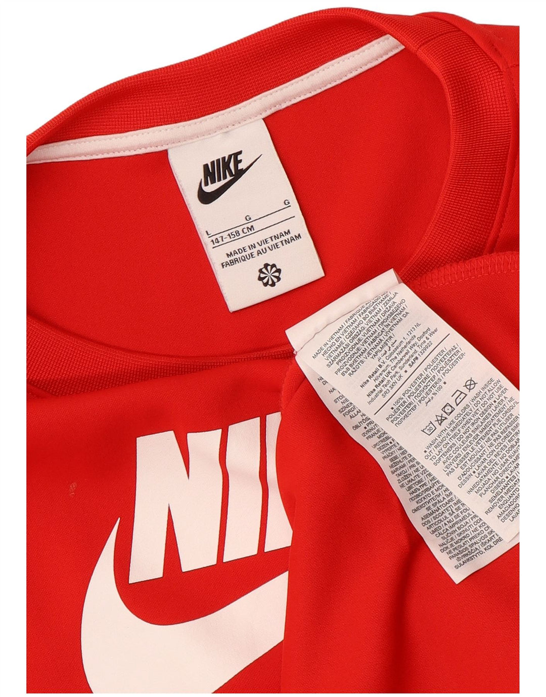 NIKE Boys Graphic Top Long Sleeve 12-13 Years Large Red Colourblock