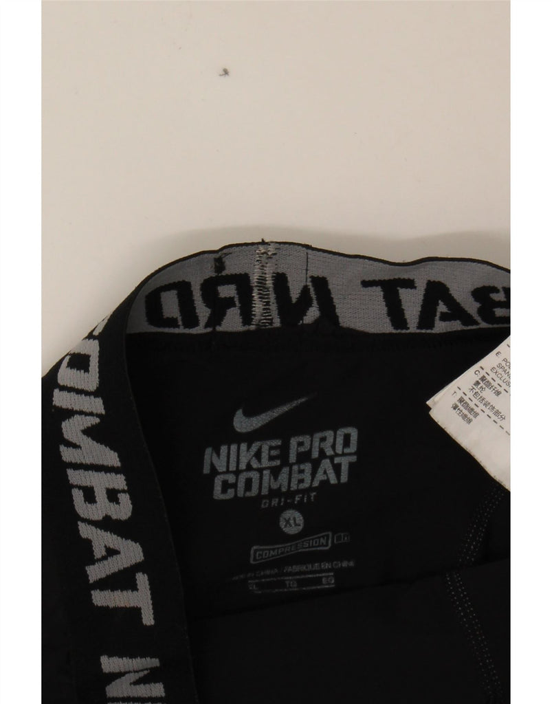 NIKE Boys Dri Fit Graphic Leggings 13-14 Years XL Black Polyester Vintage Nike and Second-Hand Nike from Messina Hembry 