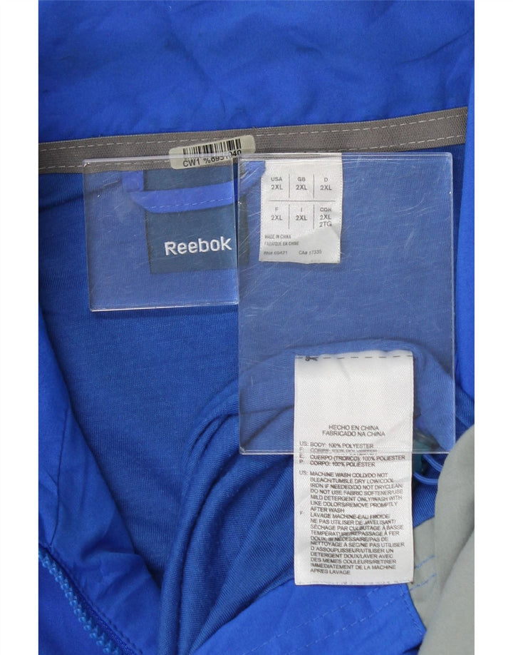 REEBOK Mens Tracksuit Top Jacket 2XL Blue Colourblock Polyester Vintage Reebok and Second-Hand Reebok from Messina Hembry 