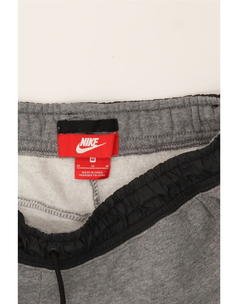 NIKE Mens Tracksuit Trousers Joggers Medium  Grey Cotton Vintage Nike and Second-Hand Nike from Messina Hembry 