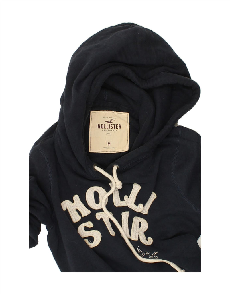 HOLLISTER Womens Graphic Hoodie Jumper UK 12 Medium Navy Blue Cotton | Vintage Hollister | Thrift | Second-Hand Hollister | Used Clothing | Messina Hembry 