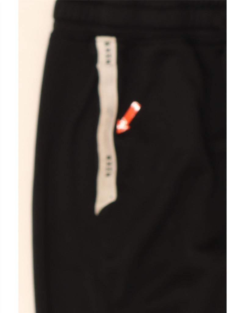 NIKE Boys Tracksuit Trousers Joggers 12-13 Years Large Black Cotton Vintage Nike and Second-Hand Nike from Messina Hembry 