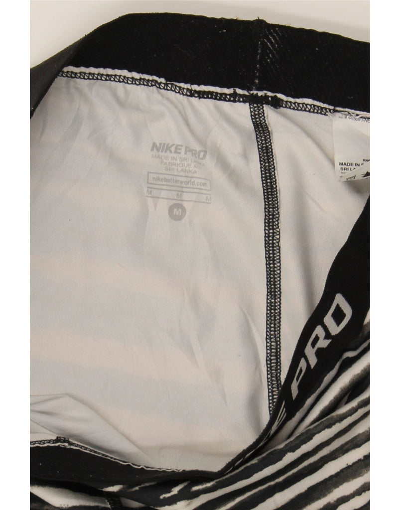 NIKE Womens Capri Leggings UK 12 Medium  Black Animal Print Polyester Vintage Nike and Second-Hand Nike from Messina Hembry 