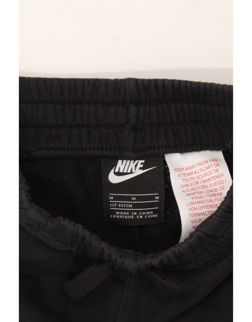 NIKE Boys Tracksuit Trousers Joggers 10-11 Years Medium Black Cotton Vintage Nike and Second-Hand Nike from Messina Hembry 