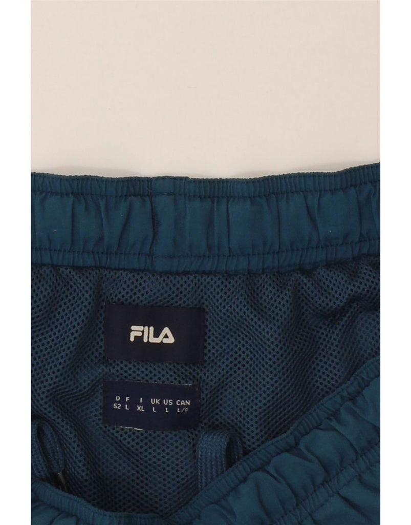 FILA Womens Sport Shorts UK 14 Large  Blue Floral Nylon Vintage Fila and Second-Hand Fila from Messina Hembry 