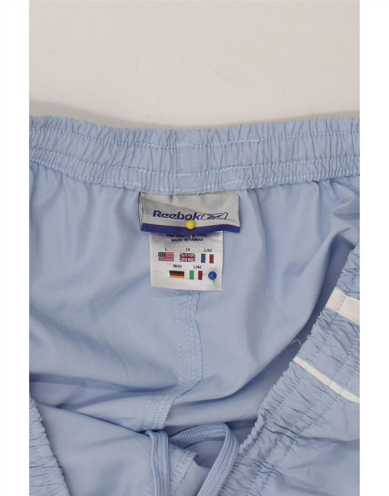 REEBOK Womens Capri Tracksuit Trousers Size 14 W34 L24 Blue Polyester Vintage Reebok and Second-Hand Reebok from Messina Hembry 