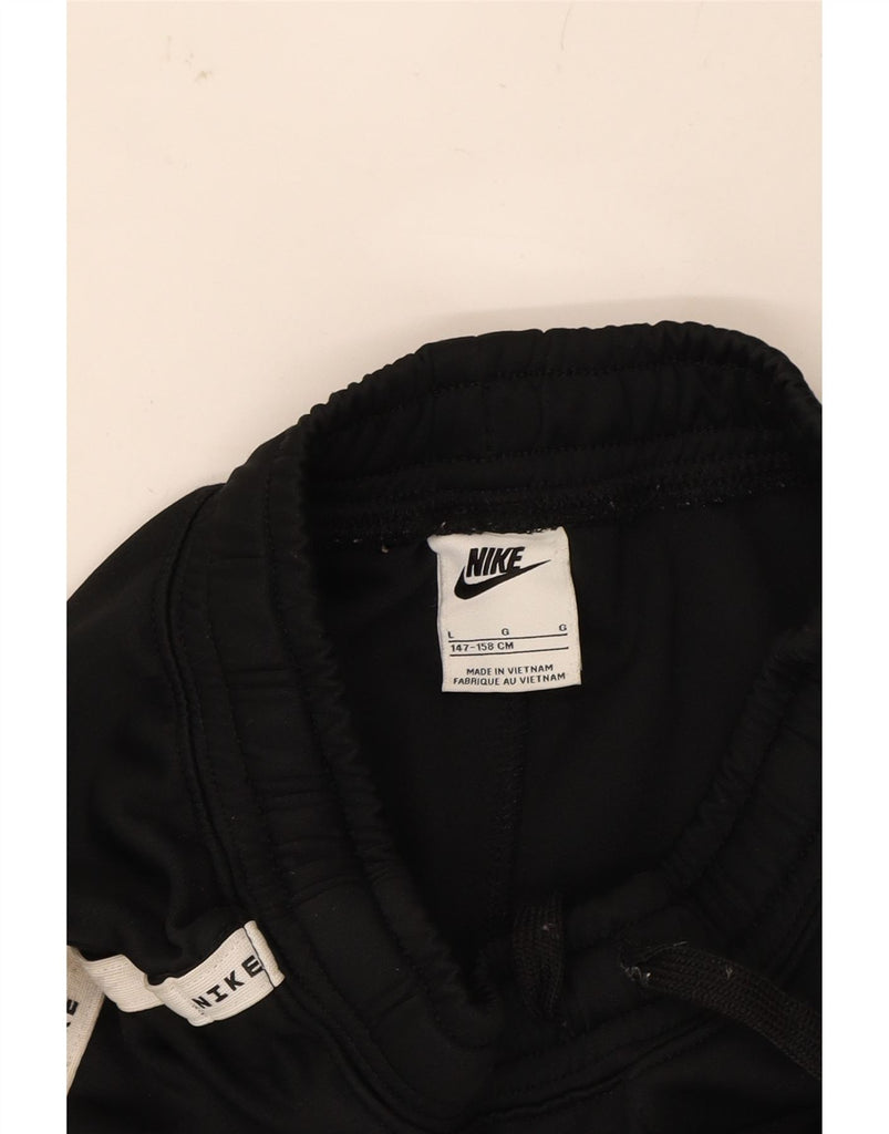 NIKE Boys Tracksuit Trousers Joggers 12-13 Years Large Black Cotton Vintage Nike and Second-Hand Nike from Messina Hembry 