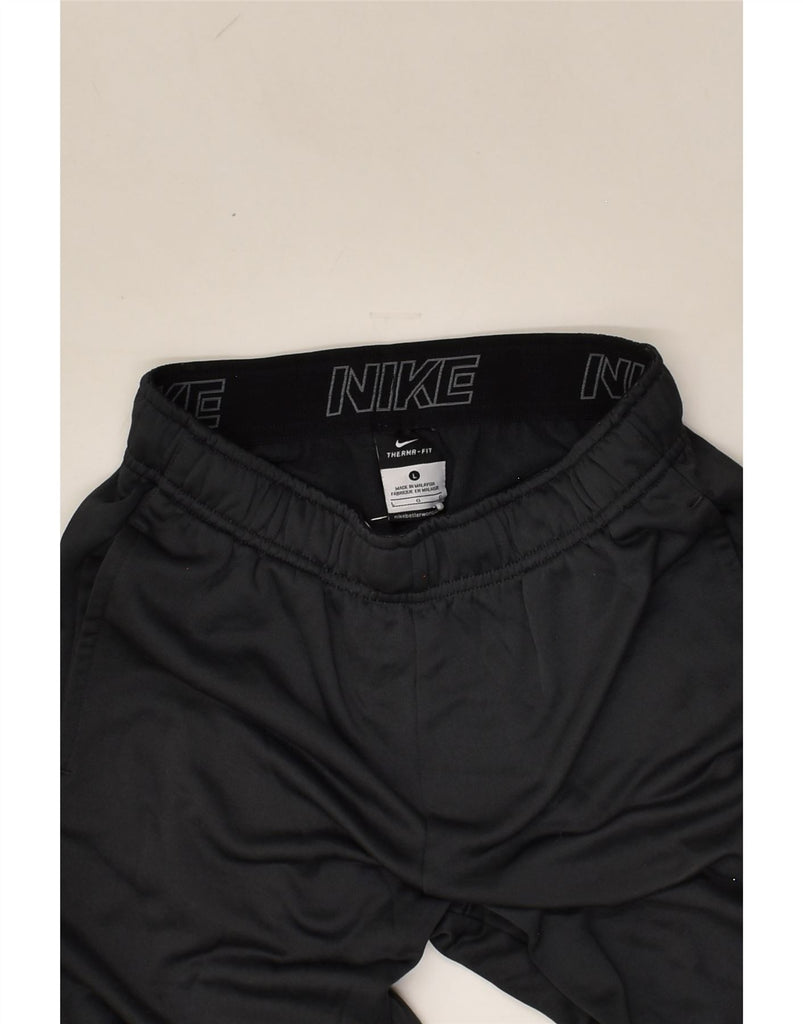 NIKE Girls Therma-Fit Tracksuit Trousers 10-11 Years Large Grey Polyester | Vintage Nike | Thrift | Second-Hand Nike | Used Clothing | Messina Hembry 