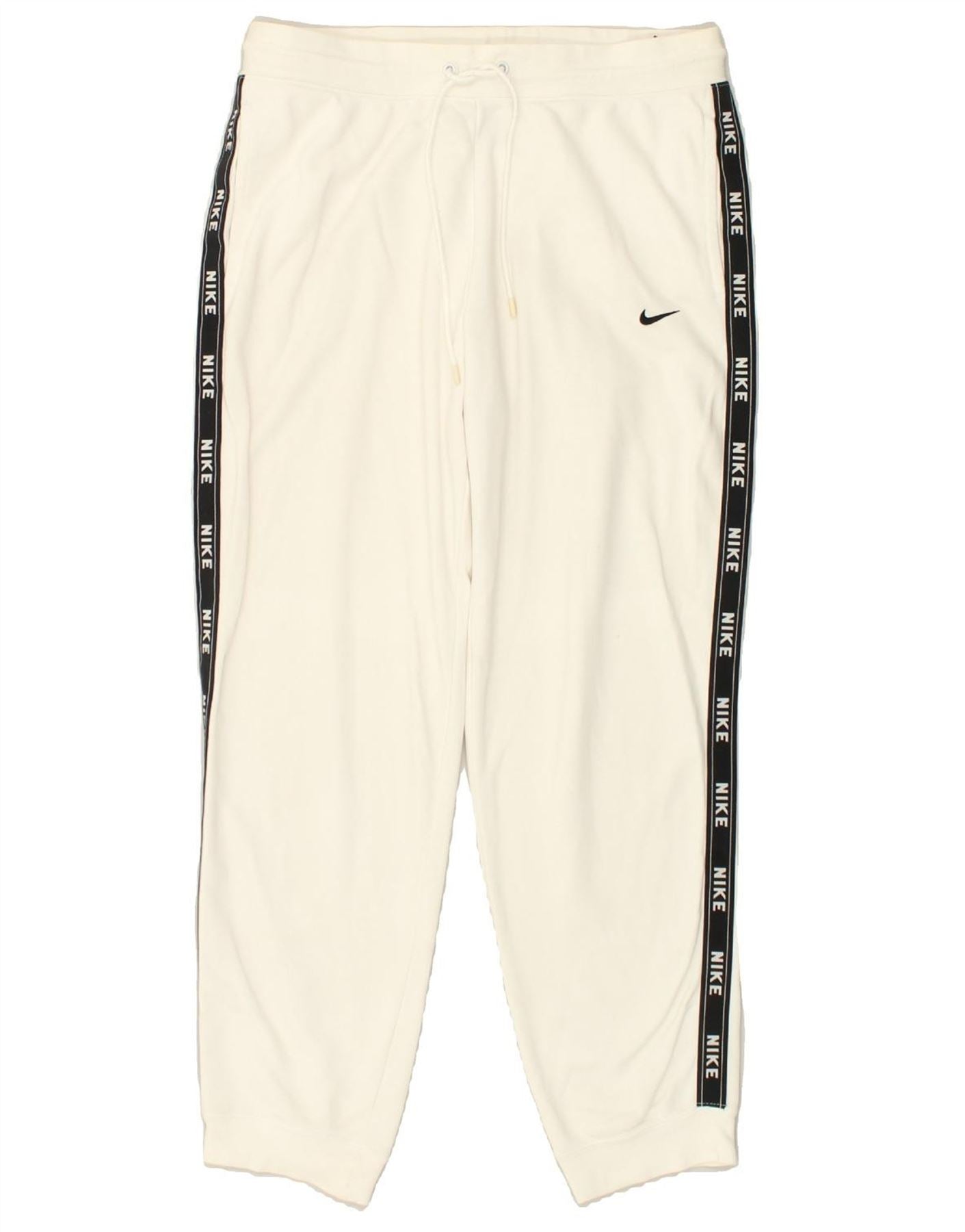 Nike logo best sale tape pant