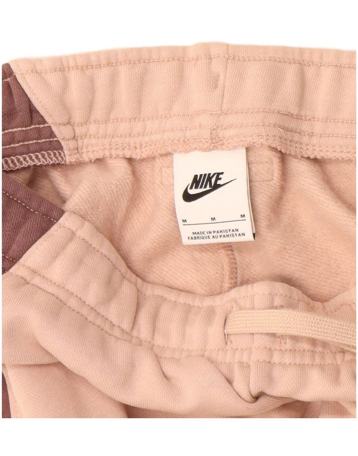 NIKE Womens Tracksuit Trousers Joggers UK 12 Medium Pink Colourblock