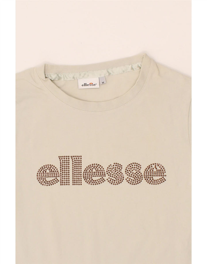 ELLESSE Womens Graphic T-Shirt Top UK 12 Medium Off White Cotton Vintage Ellesse and Second-Hand Ellesse from Messina Hembry 