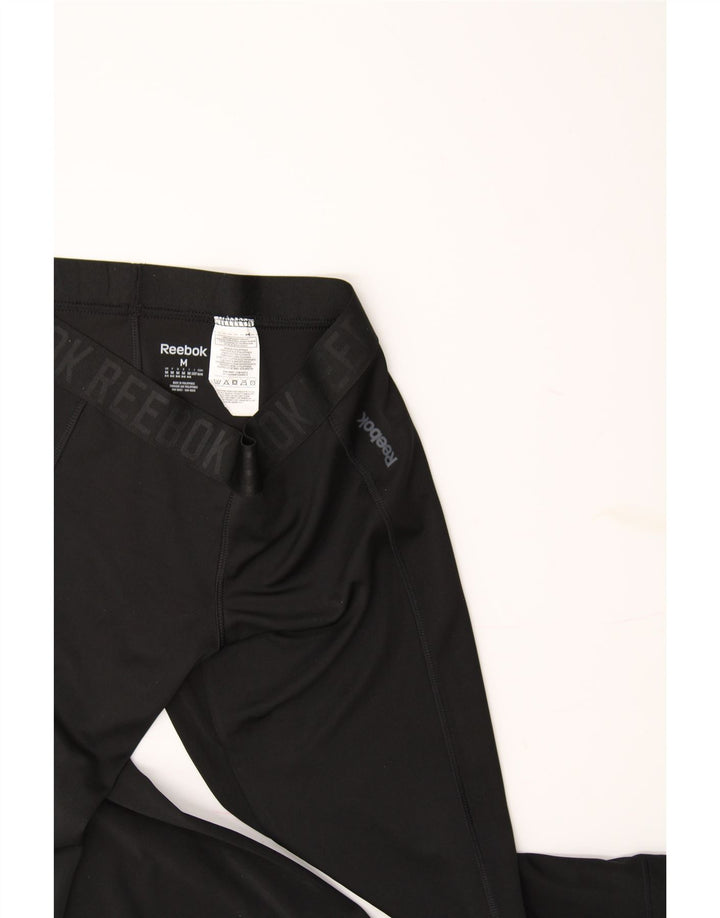 REEBOK Womens Graphic Capri Leggings UK 12/14 Medium  Black Polyester Vintage Reebok and Second-Hand Reebok from Messina Hembry 