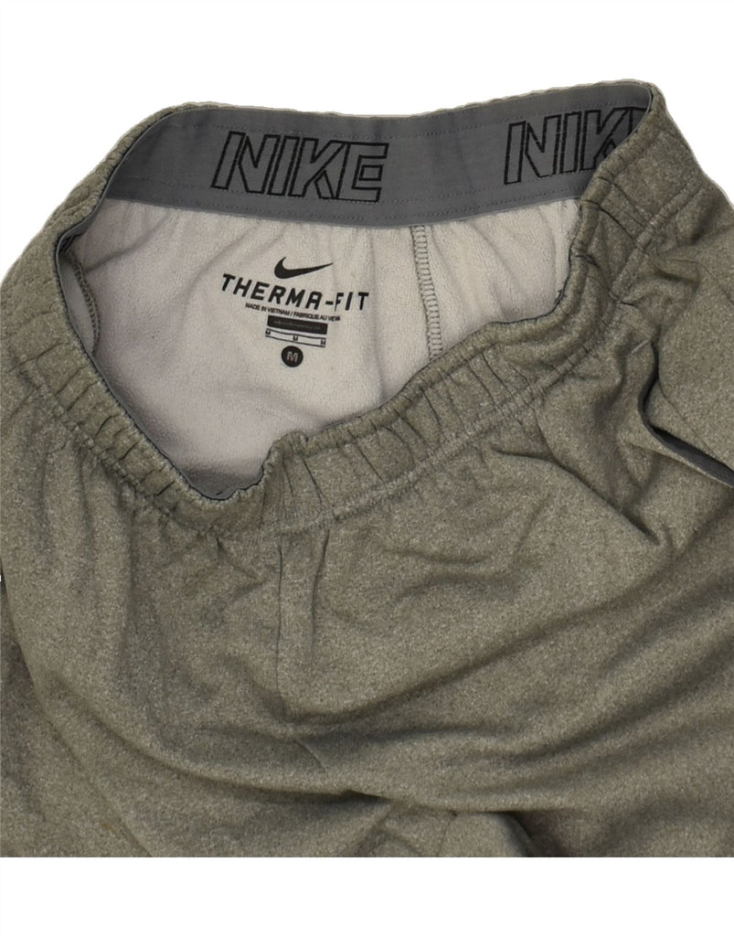 NIKE Mens Therma-Fit Tracksuit Trousers Medium Grey Polyester | Vintage Nike | Thrift | Second-Hand Nike | Used Clothing | Messina Hembry 