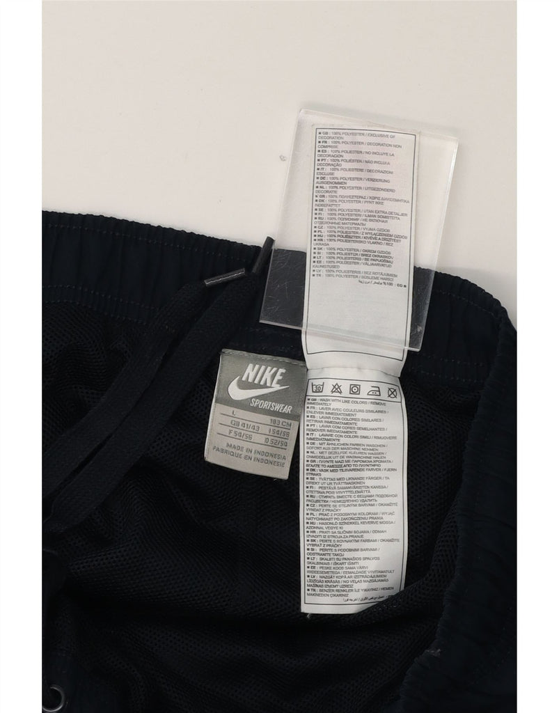 NIKE Mens Tracksuit Trousers UK 41/43 Large  Navy Blue Polyester Vintage Nike and Second-Hand Nike from Messina Hembry 