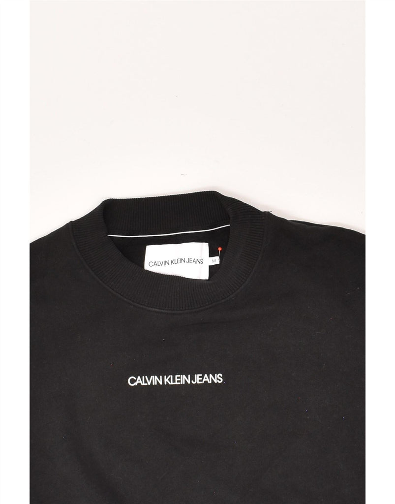 CALVIN KLEIN JEANS Womens Graphic Sweatshirt Jumper UK 14 Medium Black Vintage Calvin Klein Jeans and Second-Hand Calvin Klein Jeans from Messina Hembry 