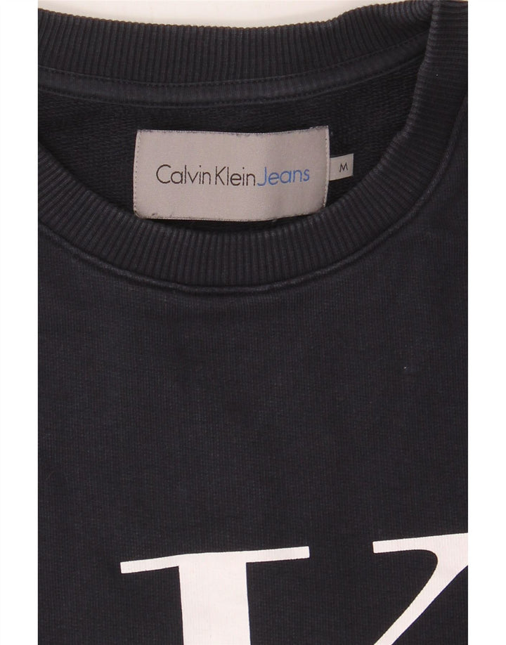 CALVIN KLEIN JEANS Mens Graphic Sweatshirt Jumper Medium Navy Blue Cotton Vintage Calvin Klein Jeans and Second-Hand Calvin Klein Jeans from Messina Hembry 
