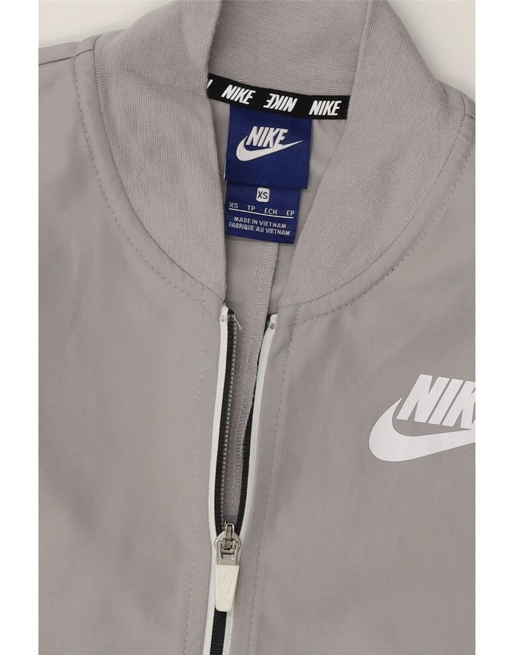 NIKE Womens Oversized Graphic Tracksuit Top Jacket UK 6 XS Grey Polyester Vintage Nike and Second-Hand Nike from Messina Hembry 