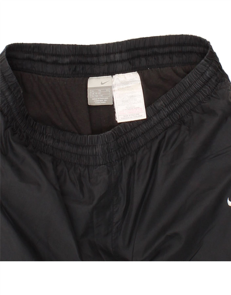 NIKE Boys Tracksuit Trousers 13-14 Years XL Black Nylon Vintage Nike and Second-Hand Nike from Messina Hembry 