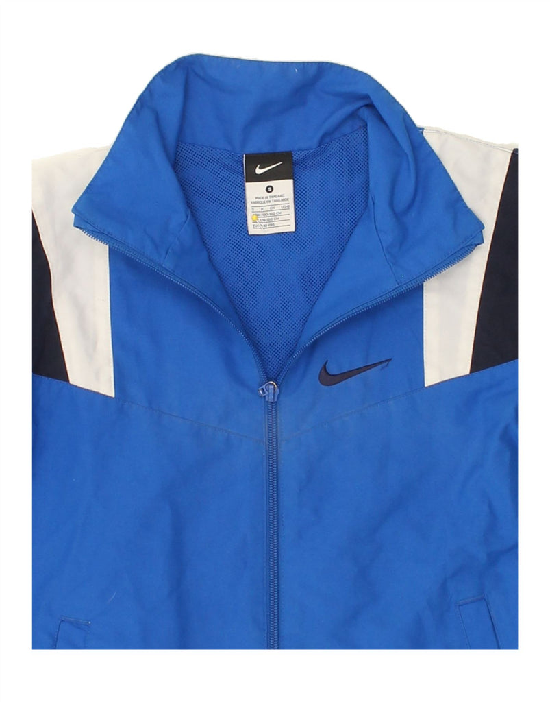 NIKE Boys Tracksuit Top Jacket 8-9 Years Small Blue Colourblock Nylon Vintage Nike and Second-Hand Nike from Messina Hembry 