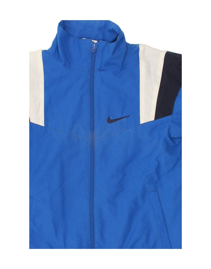 NIKE Boys Tracksuit Top Jacket 8-9 Years Small Blue Colourblock Nylon Vintage Nike and Second-Hand Nike from Messina Hembry 