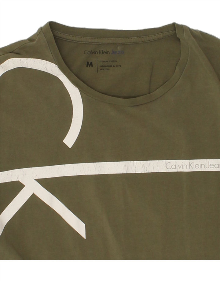 CALVIN KLEIN Mens Graphic T-Shirt Top Medium Green Cotton Vintage Calvin Klein and Second-Hand Calvin Klein from Messina Hembry 