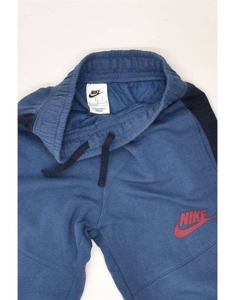 NIKE Boys Tracksuit Trousers Joggers 10-11 Years Medium Blue Colourblock | Vintage Nike | Thrift | Second-Hand Nike | Used Clothing | Messina Hembry 